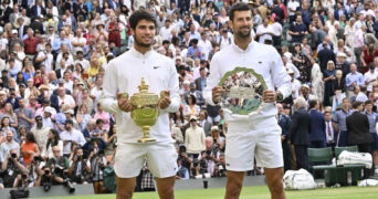 Carlos Alcaraz and Novak Djokovic during the trophy presentation at Wimbledon 2023