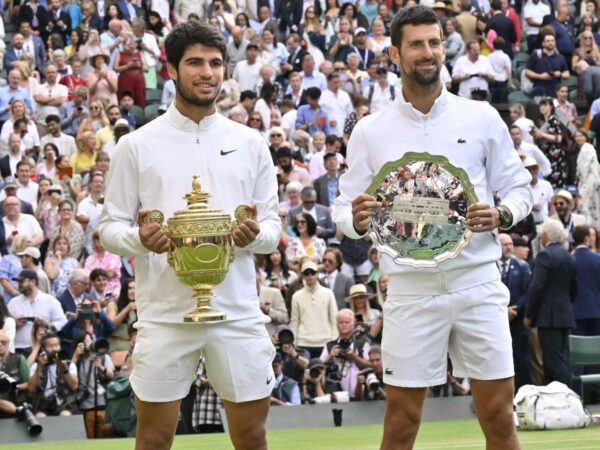 Carlos Alcaraz and Novak Djokovic during the trophy presentation at Wimbledon 2023