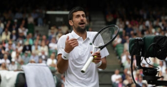 Novak Djokovic speaks to the Chair Umpire during the 2023 Wimbledon final