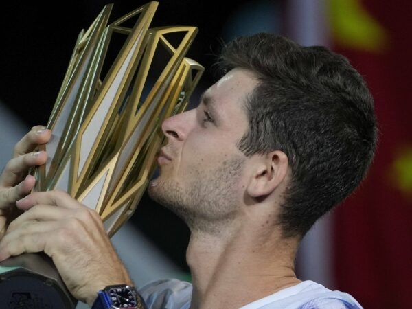Hubert Hurkacz of Poland kisses his winning trophy after defeating Andrey Rublev in Shanghai
