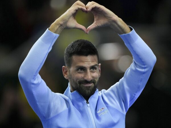 Novak Djokovic gestures to the crowd during an exhibition tennis match against Argentina's Juan Martin Del Potro in Buenos Aires.