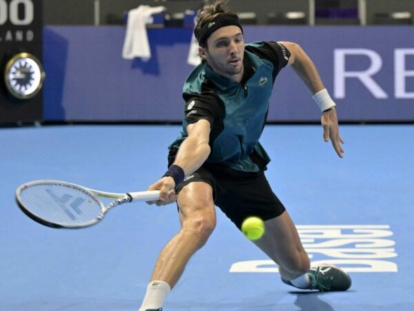 Arthur Rinderknech from France hits a slice forehand while playing against Holger Rune in semi-final in Basel in 2022
