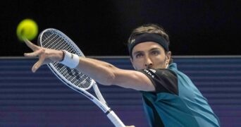 Arthur Rinderknechs hits a forehand against Marin Cilic in Basel in 2022