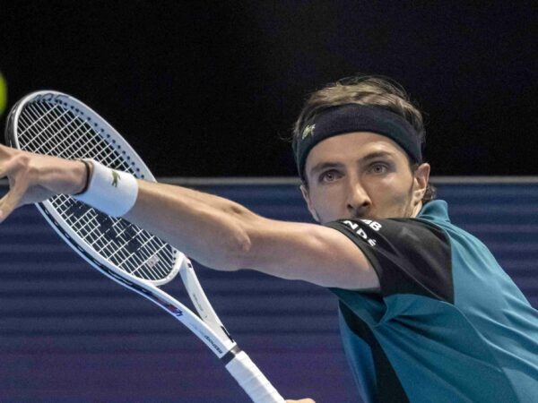 Arthur Rinderknechs hits a forehand against Marin Cilic in Basel in 2022