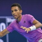 Felix Auger-Aliassime hits a forehand return to Marc-Andrea Huesler at the first round of Basel in 2022