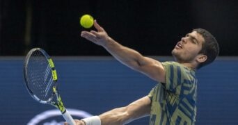 Carlos Alcaraz toss the ball for a serve during his first round match against Jack Draper in Basel in 2022