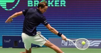 Daniil Medvedev hits a slice backhand against Novak Djokovic during their semi-final in Astana in 2022