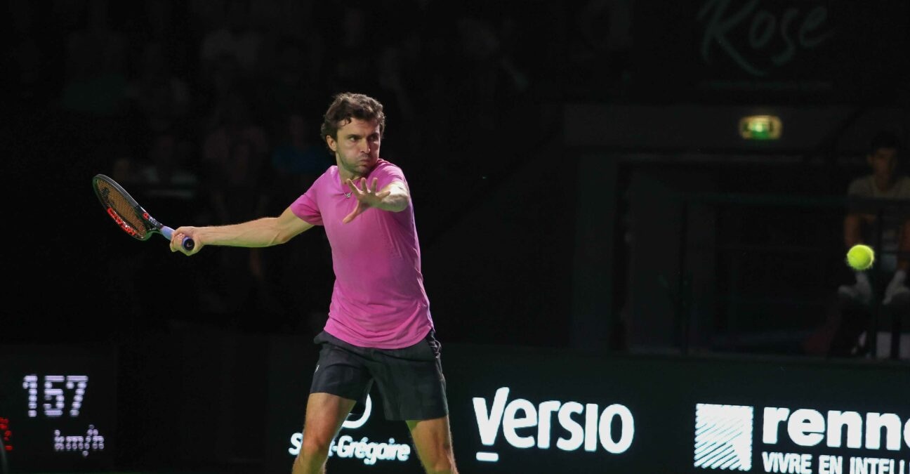 Gilles Simon hits a forehand in the dark at the Rennes Open in 2022
