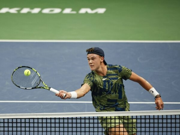 Holger Rune hits a forehand dropshot volley during his semi final against de Minaur in Stockholm in 2022