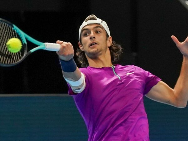 Lorenzo Musetti hits a forehand in Basel in 2022