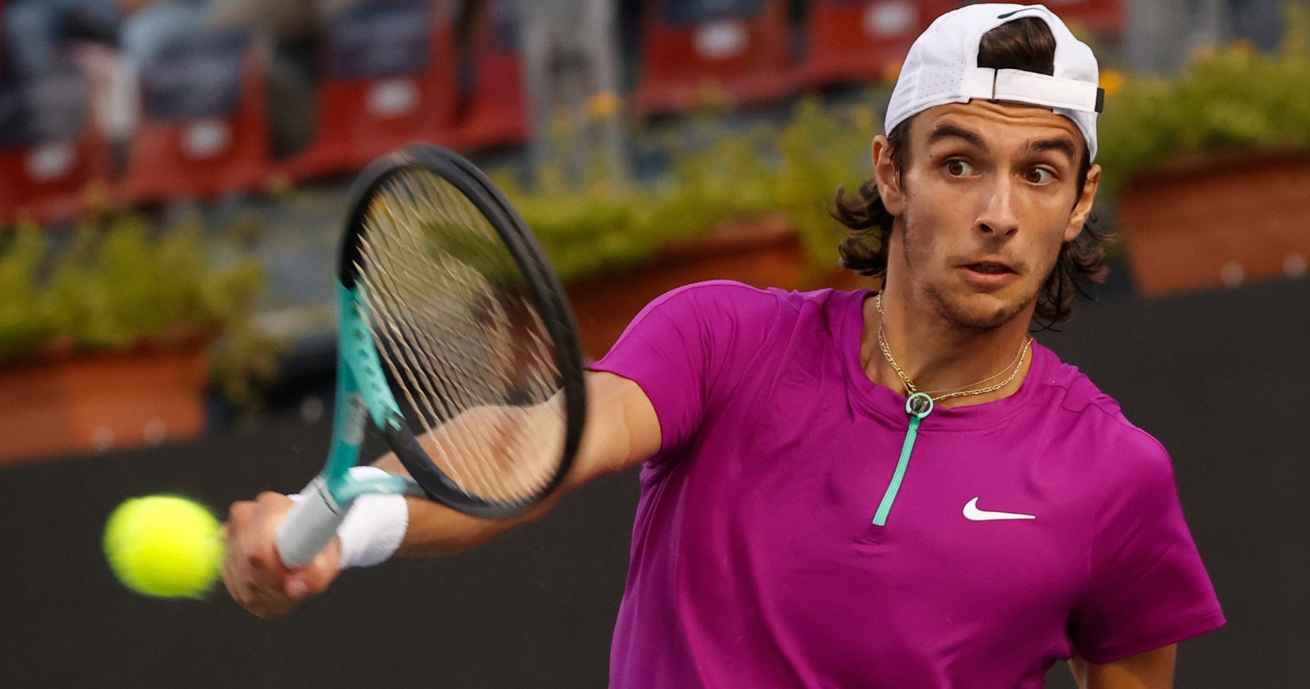 Lorenzo Musetti hits a one-handed backhand during his win against fellowman Matteo Berrettini in the final of Napoli