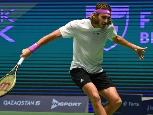 Stefanos Tsitsipas hits a slice backhand agains Novak Djokovic during the final of the tournament of Astana in 2022